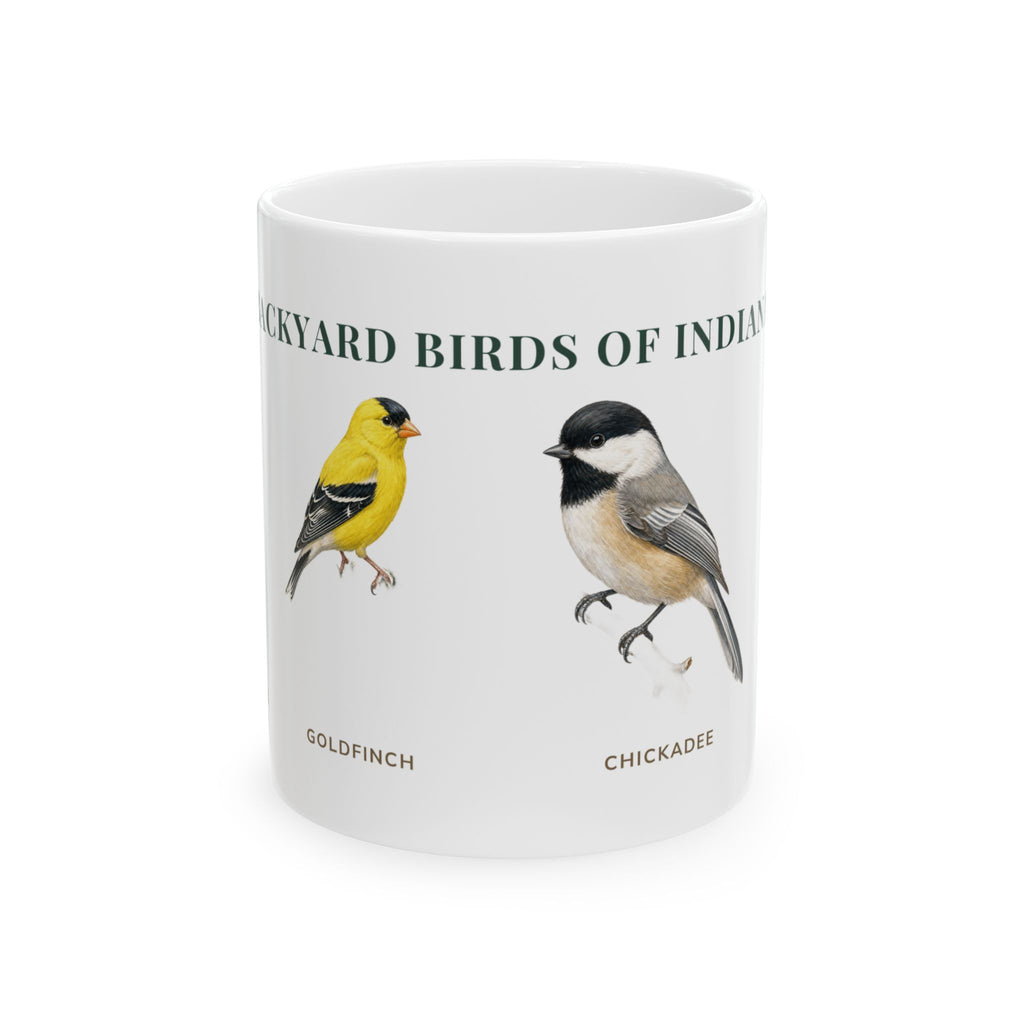 Backyard Birds of Indiana ceramic mug with labeled illustrations of American Goldfinch, Black-capped Chickadee, Northern Cardinal and Eastern Bluebird
