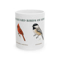 Backyard Birds of Iowa ceramic mug with labeled Northern Cardinal and Chickadee illustrations