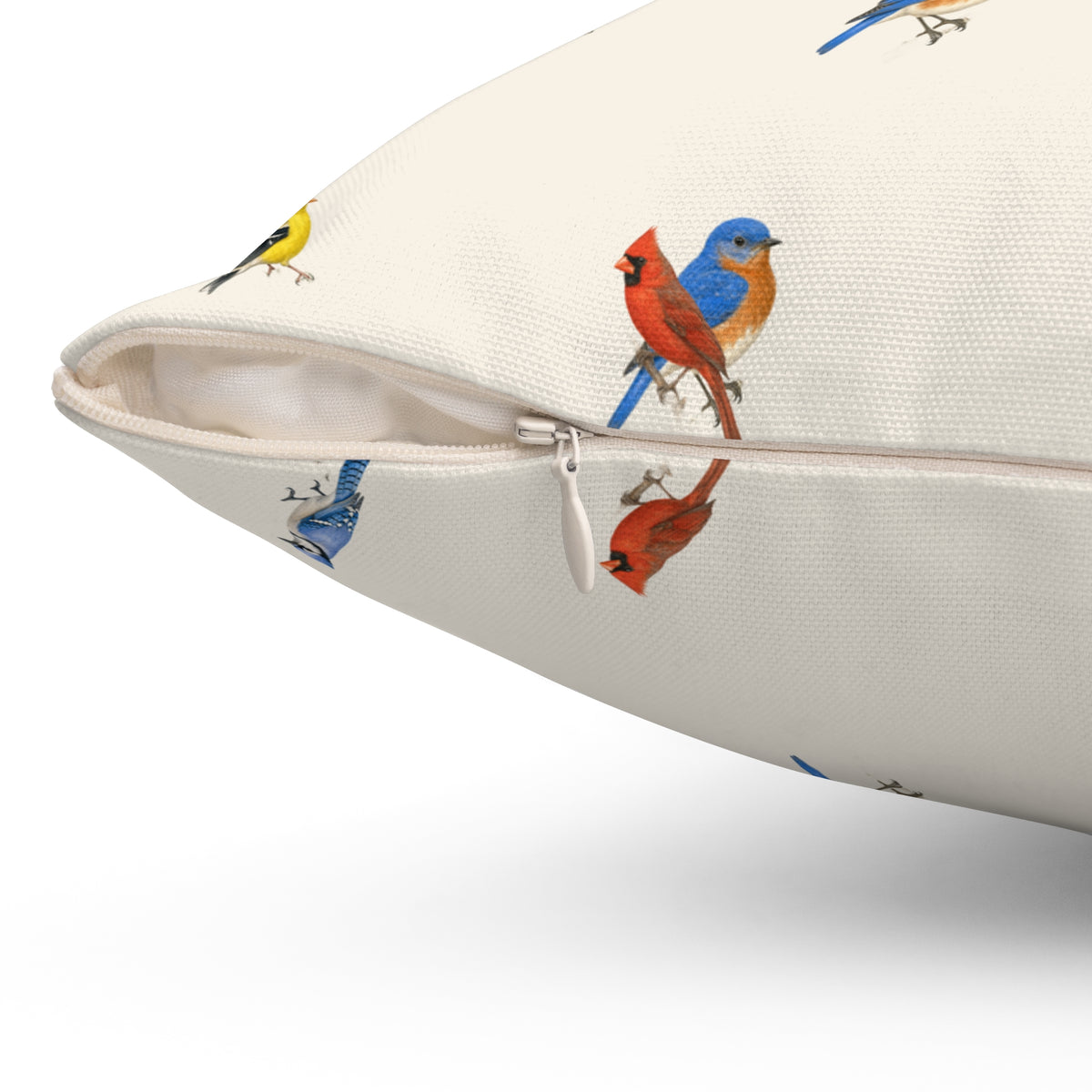 Close-up of the Backyard Songbird pillow's concealed zipper and printed birds