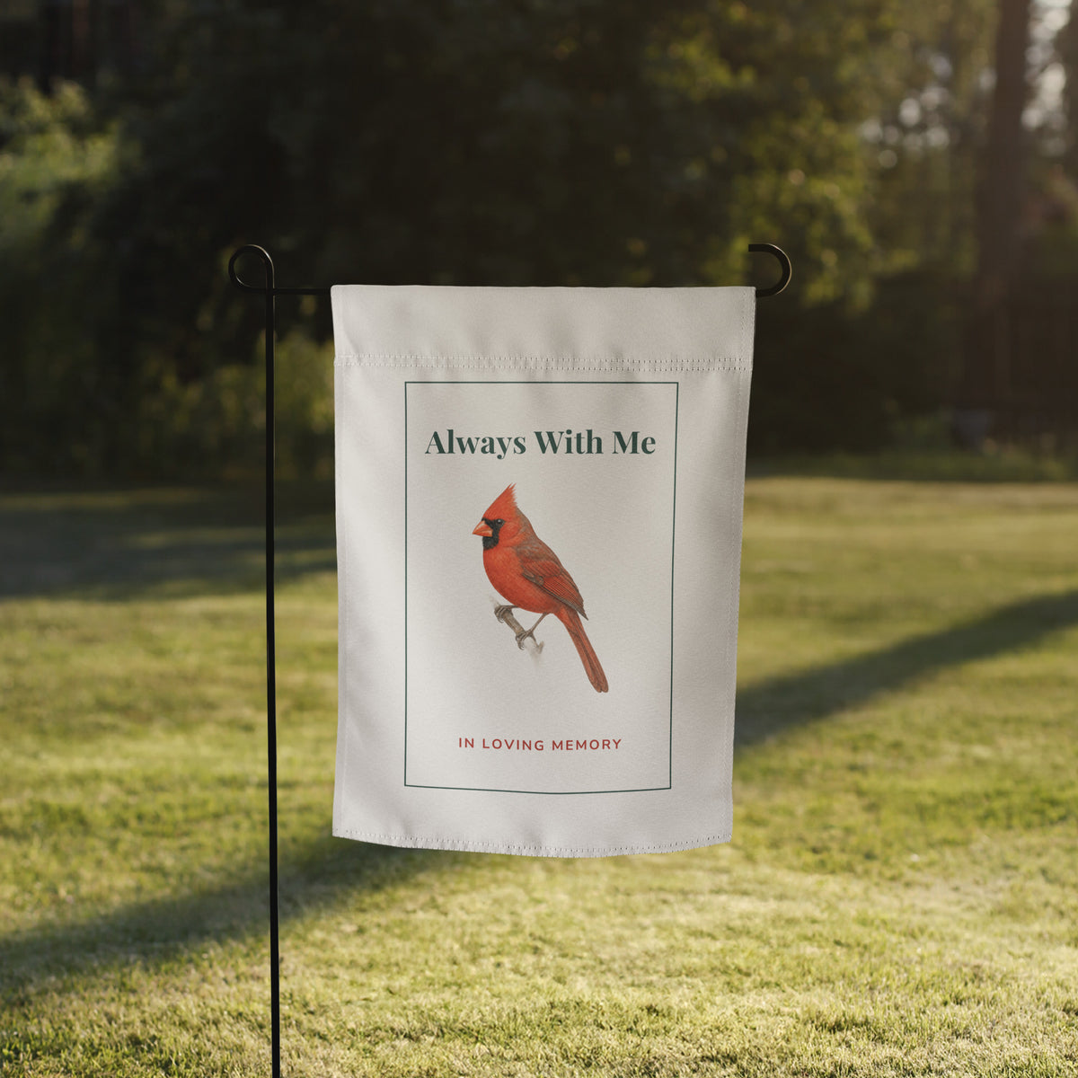 Cardinal memorial garden flag on a lawn in front of a house