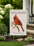 Cardinal memorial garden flag Always With Me in a flower bed by the porch