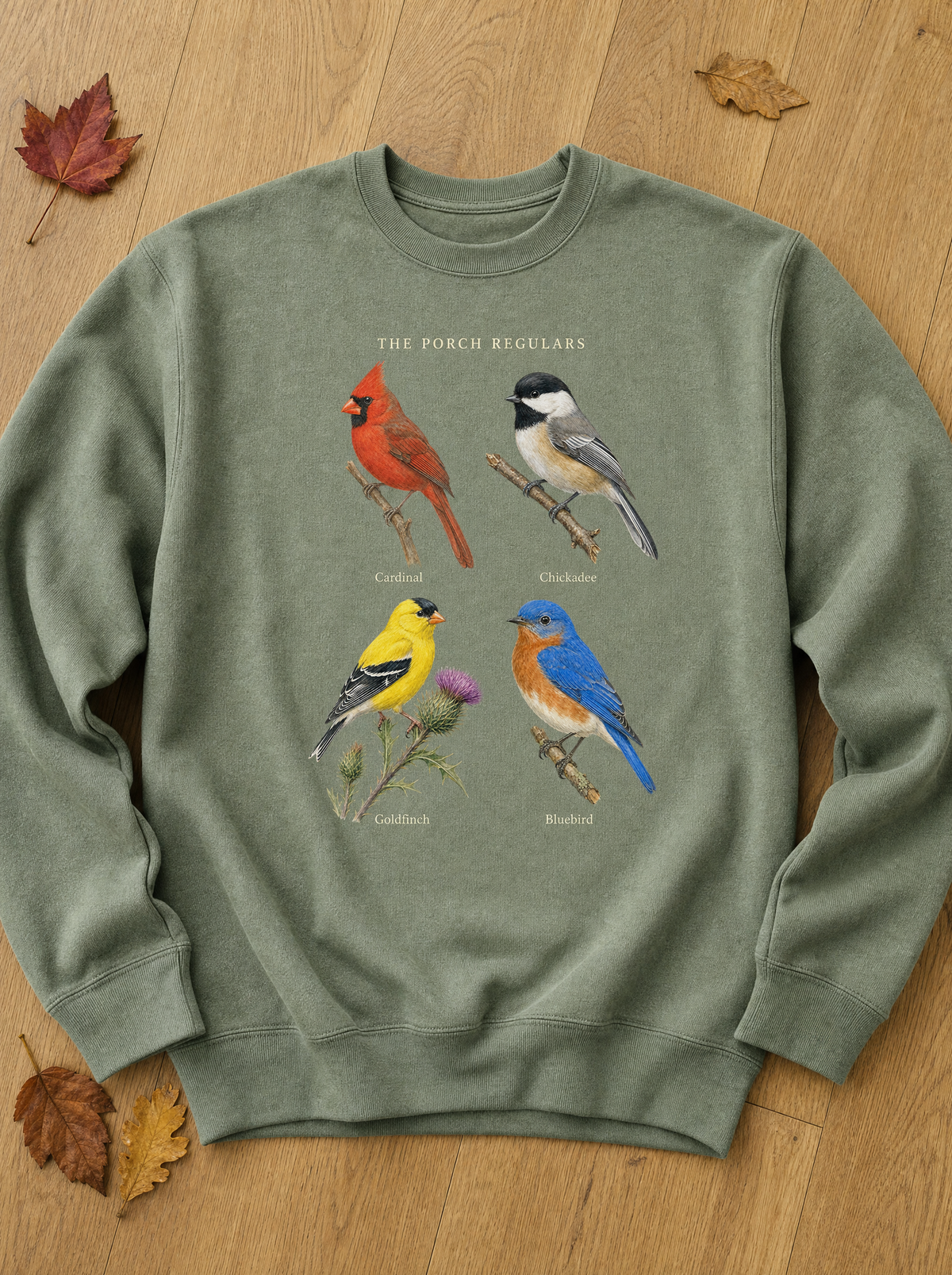 Sage green crewneck sweatshirt with The Porch Regulars bird print